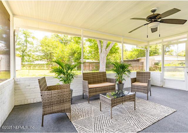 sunroom / solarium with ceiling fan