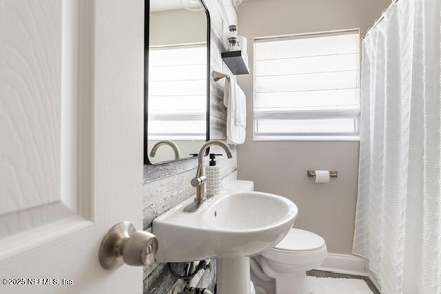 bathroom with toilet and sink