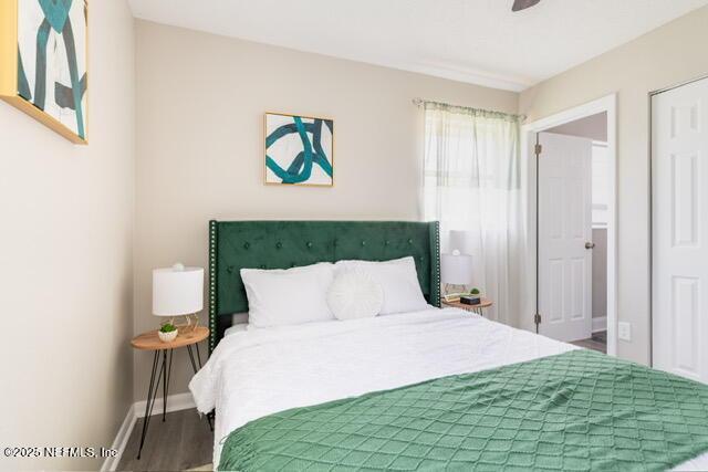 bedroom featuring ceiling fan and wood-type flooring