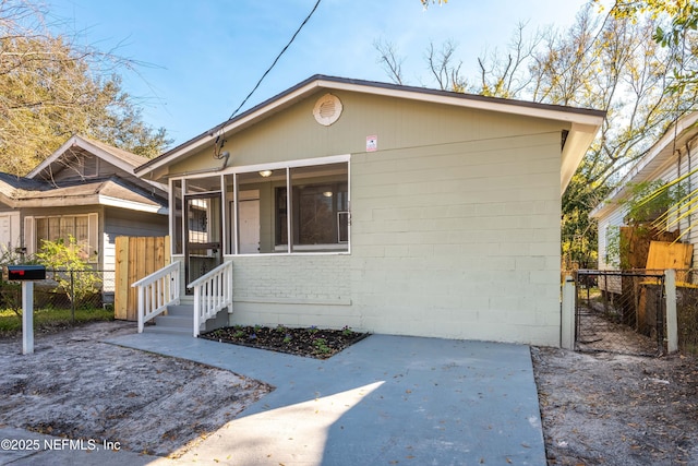 view of front of property with a sunroom