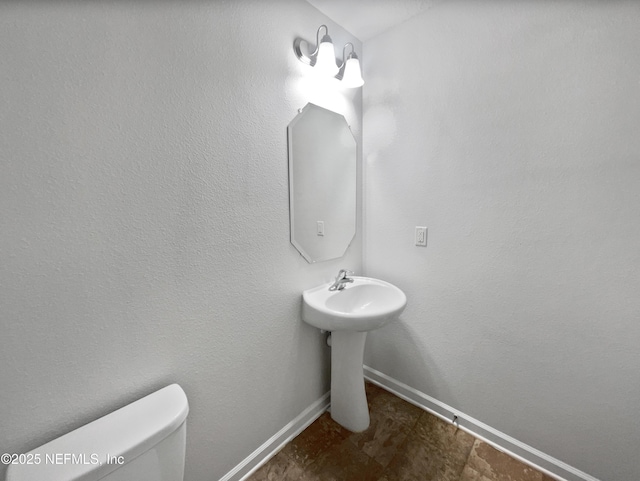 bathroom featuring toilet