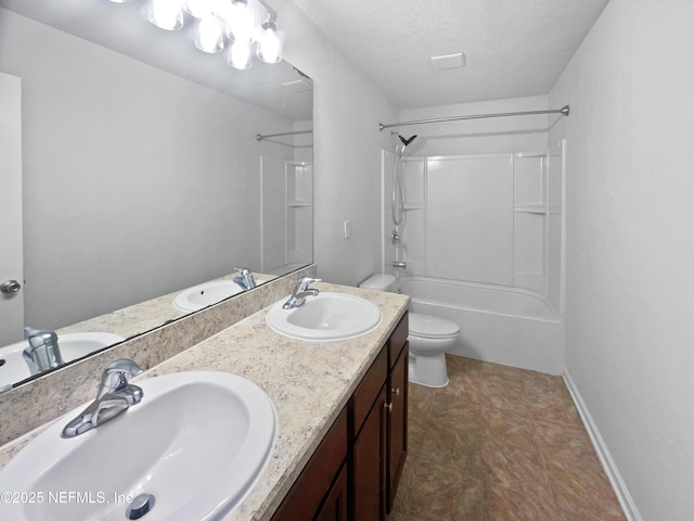 full bathroom with a textured ceiling, toilet, vanity, and bathing tub / shower combination