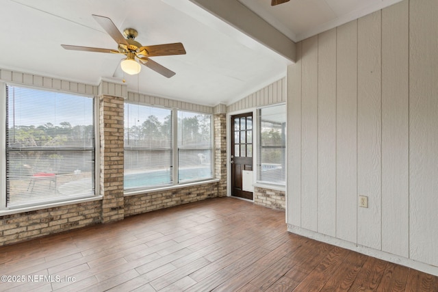 unfurnished sunroom featuring lofted ceiling and ceiling fan