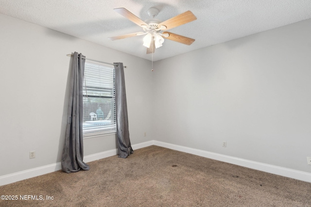 carpeted empty room featuring a textured ceiling and ceiling fan