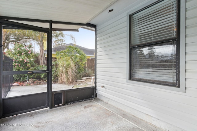 unfurnished sunroom with plenty of natural light