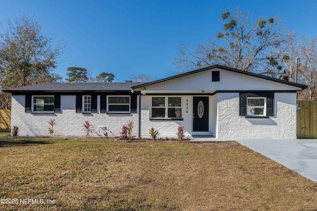 ranch-style house with a front lawn