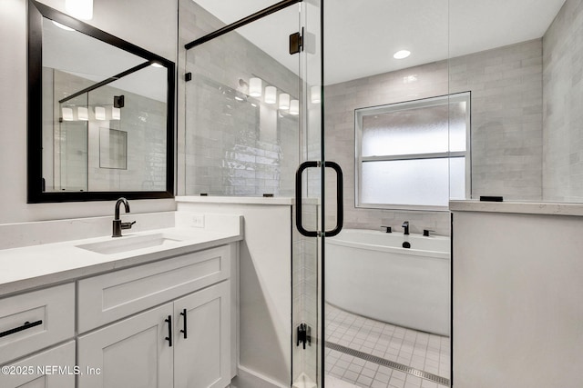 bathroom with plus walk in shower and vanity