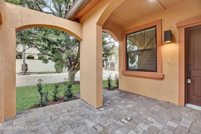 doorway to property featuring a patio area