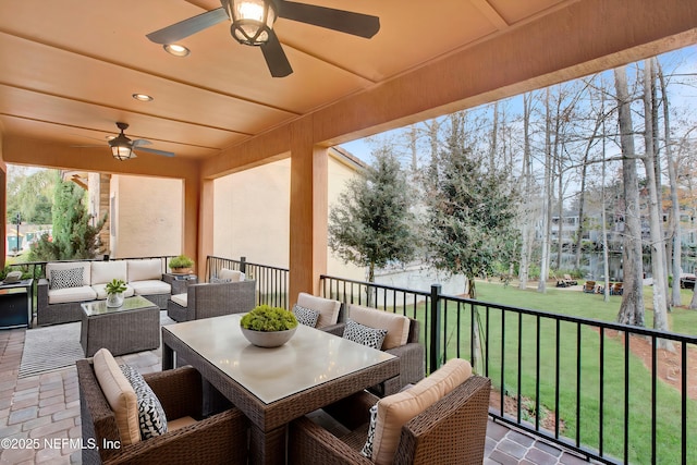 view of patio / terrace with ceiling fan and outdoor lounge area