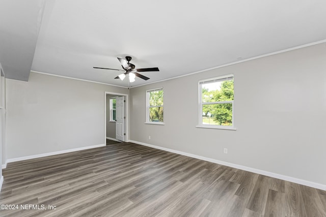 unfurnished room featuring ceiling fan, ornamental molding, and wood-type flooring