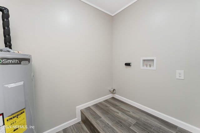 laundry area with water heater, crown molding, hookup for a washing machine, and hardwood / wood-style floors