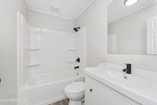 full bathroom with toilet, shower / bath combination, hardwood / wood-style flooring, and vanity