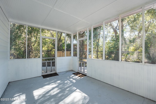 unfurnished sunroom featuring plenty of natural light