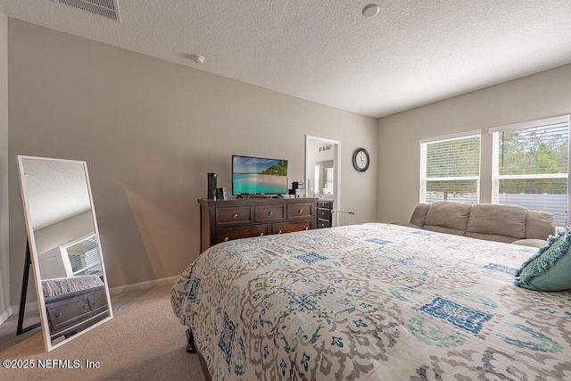 carpeted bedroom with a textured ceiling