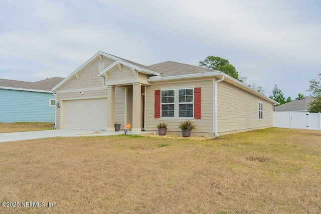 view of front of house featuring a garage and a front lawn