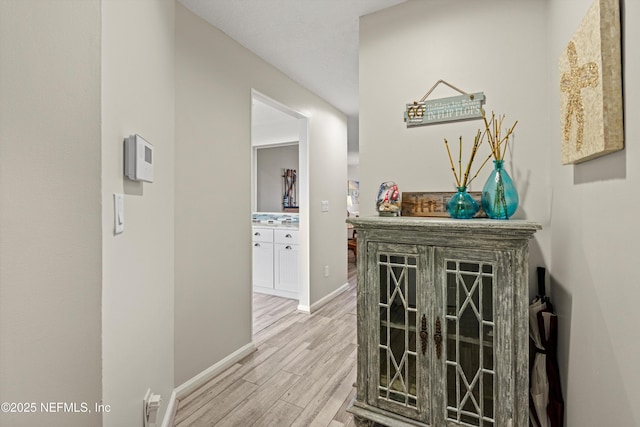 corridor featuring hardwood / wood-style flooring