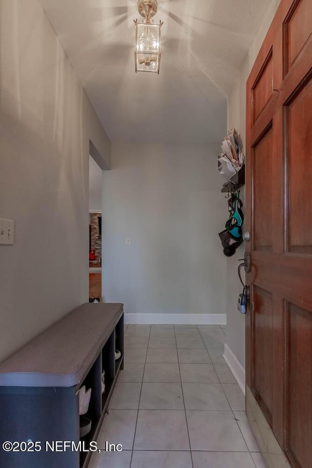 entryway featuring light tile patterned floors