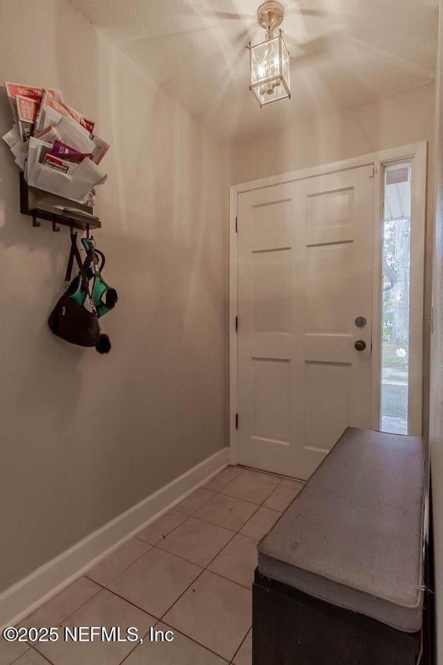 foyer with tile patterned floors