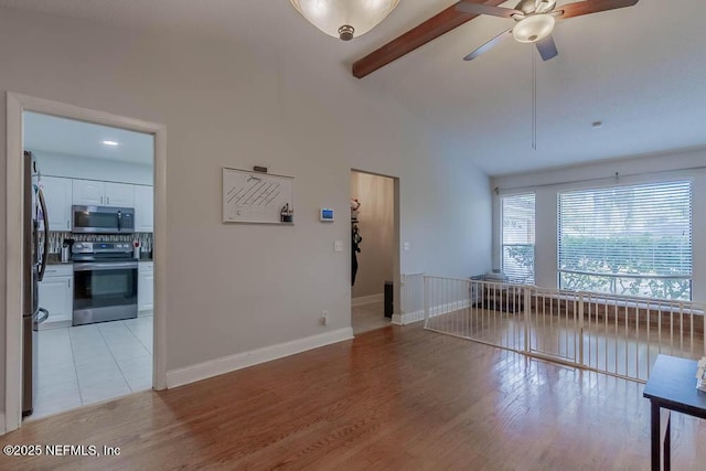 living room with light wood-type flooring, ceiling fan, high vaulted ceiling, and beamed ceiling