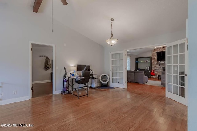 interior space featuring ceiling fan, hardwood / wood-style floors, lofted ceiling with beams, and french doors