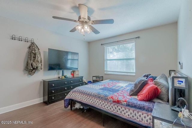 bedroom with ceiling fan and hardwood / wood-style floors