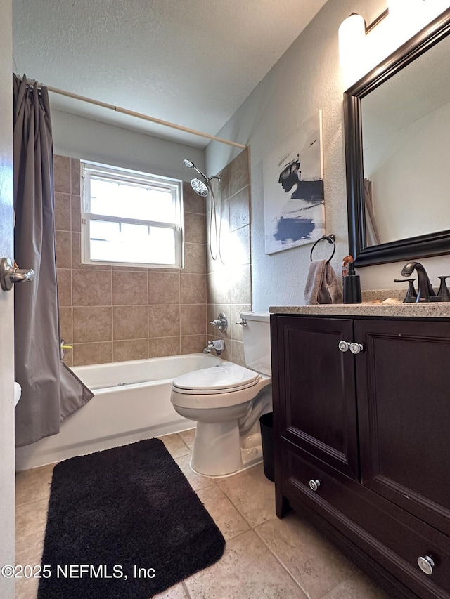 full bathroom featuring toilet, vanity, tile patterned flooring, and shower / bath combo