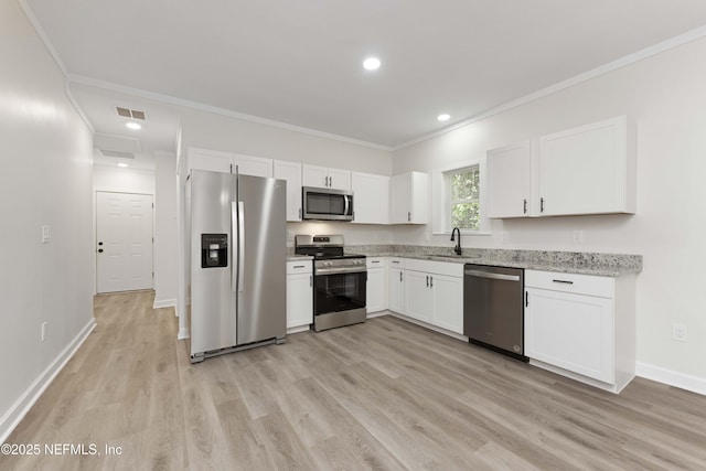 kitchen with white cabinetry, stainless steel appliances, sink, light hardwood / wood-style flooring, and crown molding