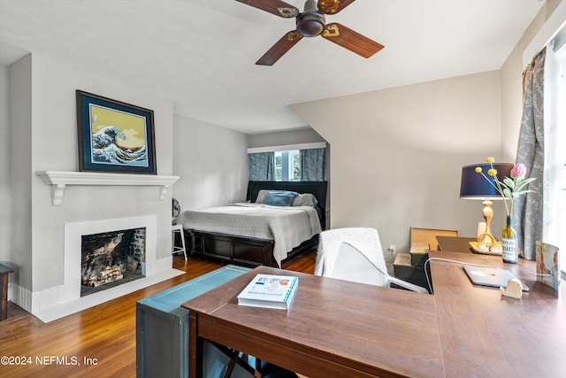 bedroom featuring ceiling fan and dark hardwood / wood-style floors