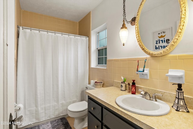 bathroom with toilet, tile walls, a shower with shower curtain, and vanity