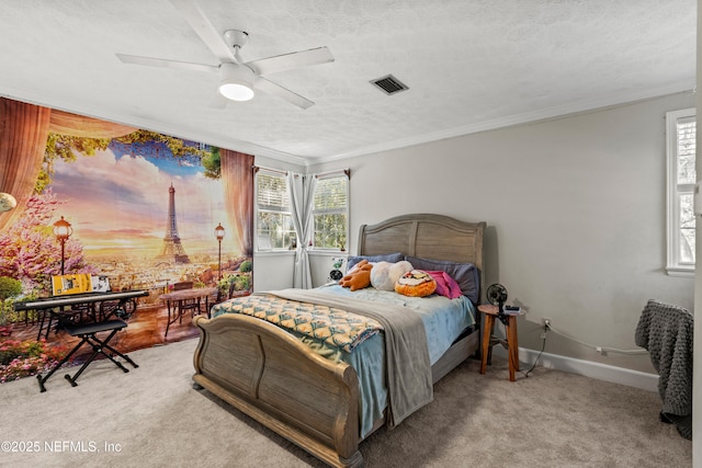 bedroom with ceiling fan, a textured ceiling, light carpet, and ornamental molding