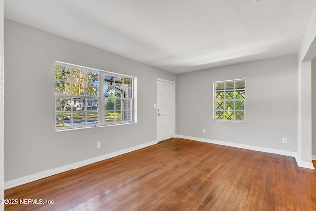 empty room featuring wood-type flooring