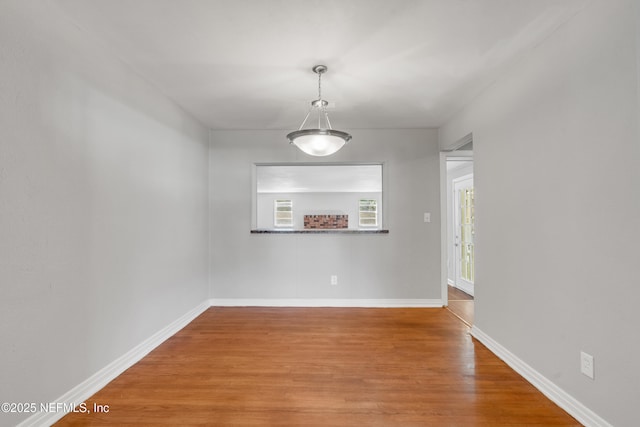 unfurnished room featuring hardwood / wood-style floors