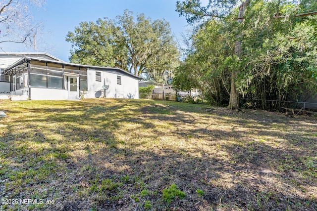 view of yard with a sunroom