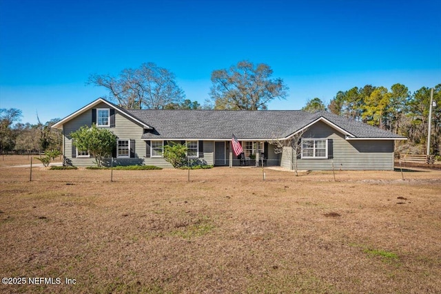 ranch-style home with a front lawn