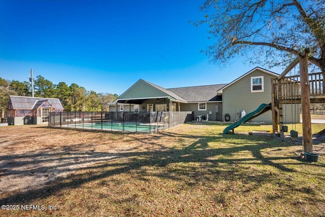 exterior space featuring a playground and a yard