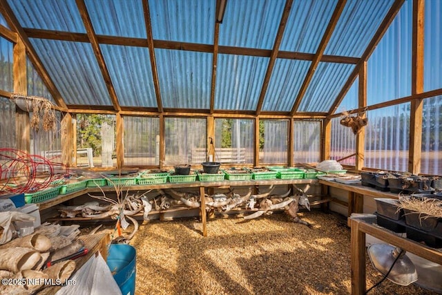 sunroom featuring lofted ceiling