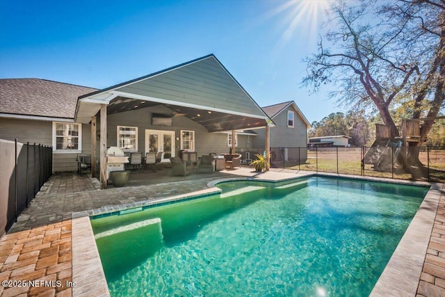 view of pool featuring french doors, ceiling fan, outdoor lounge area, and a patio