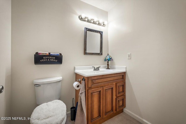 bathroom featuring toilet and vanity