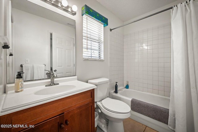 full bathroom with tile patterned floors, toilet, vanity, and shower / bath combination with curtain