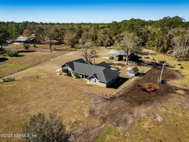 birds eye view of property with a rural view