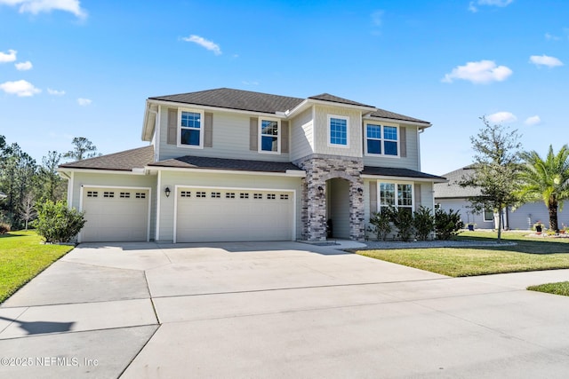 view of front of house with a garage and a front yard