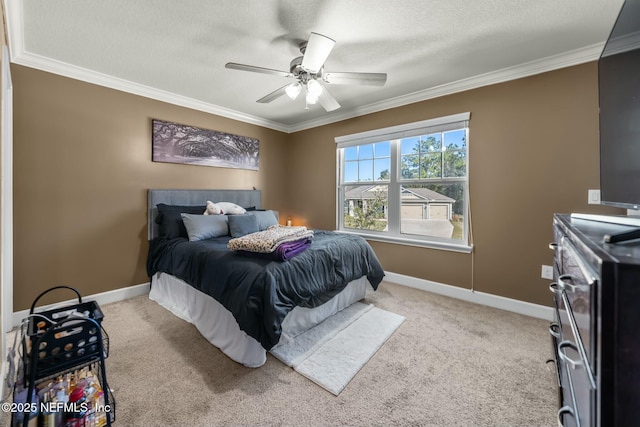 bedroom with ceiling fan, light colored carpet, ornamental molding, and a textured ceiling