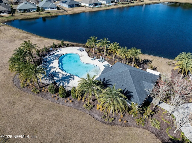 birds eye view of property with a water view