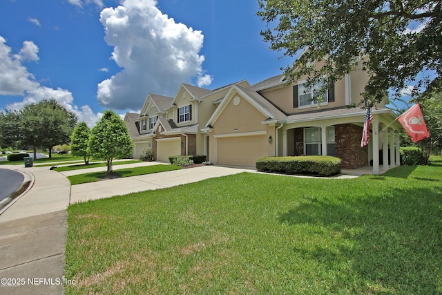 view of front of home featuring a front yard and a garage