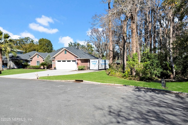 view of front of house featuring a garage and a front yard