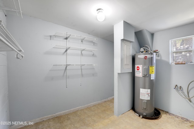 utility room featuring water heater