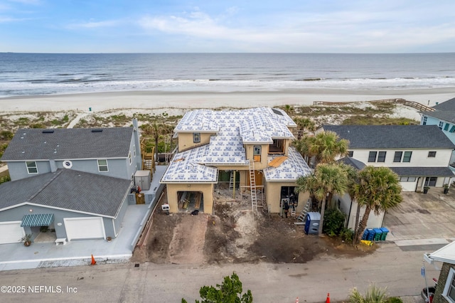 aerial view featuring a water view and a view of the beach