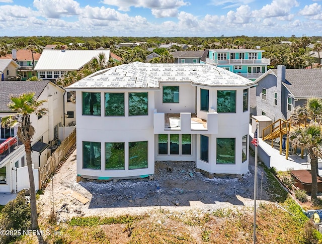 1509 Oceanfront, Neptune Beach, FL 32266 - rear view of property featuring a residential view, fence, and stucco siding