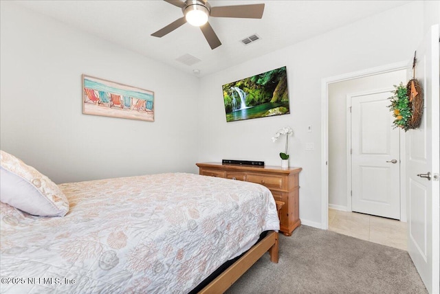 bedroom with ceiling fan and light colored carpet