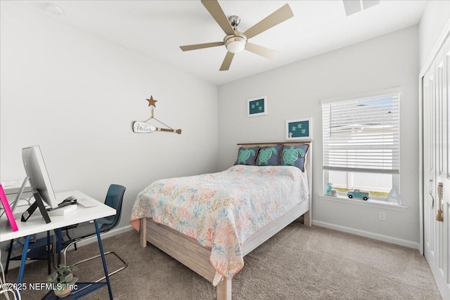 bedroom with carpet floors, a closet, and ceiling fan